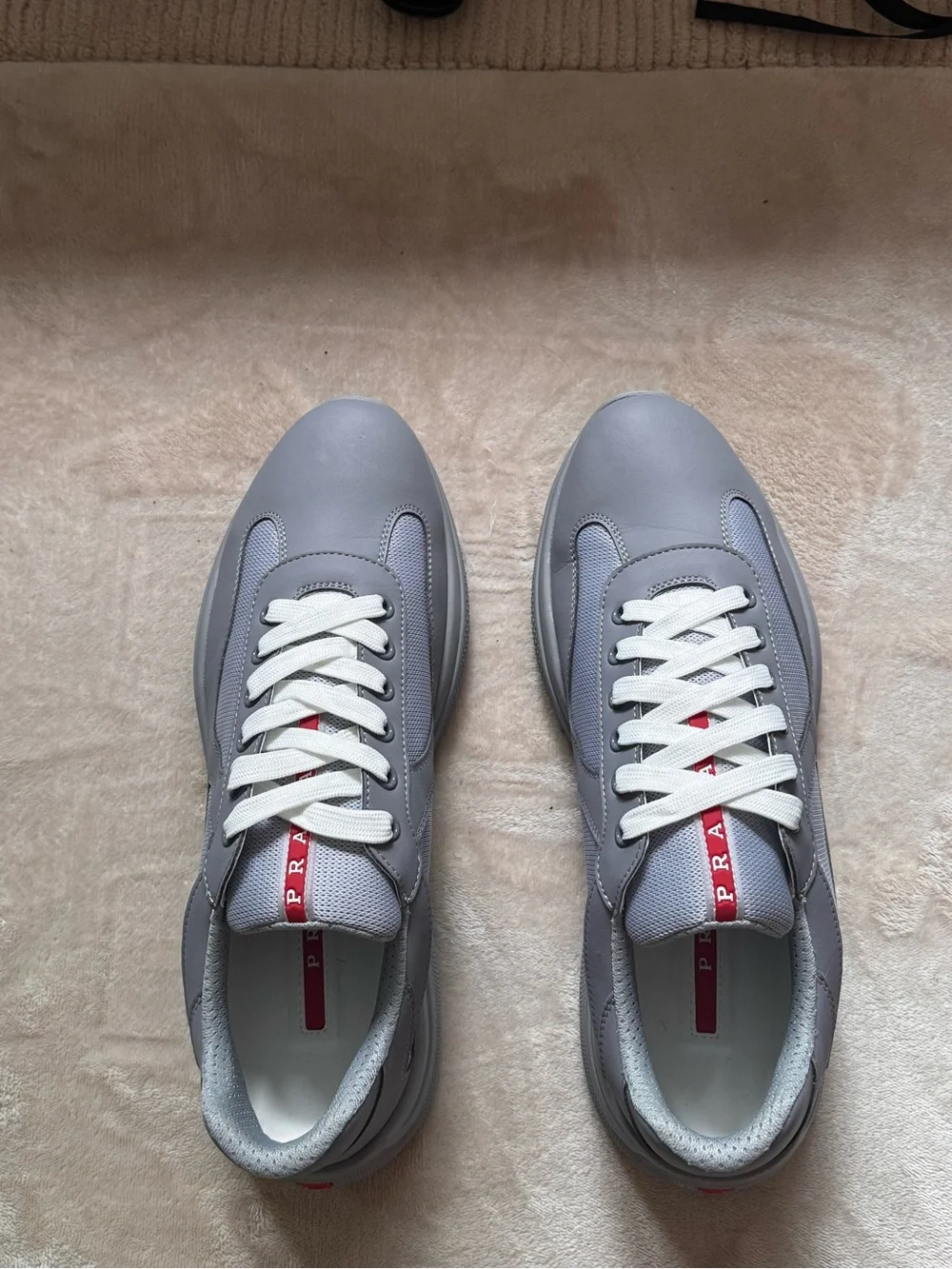 Prada Gray and White Men's Low-Top Sneakers with Red Logo Tab